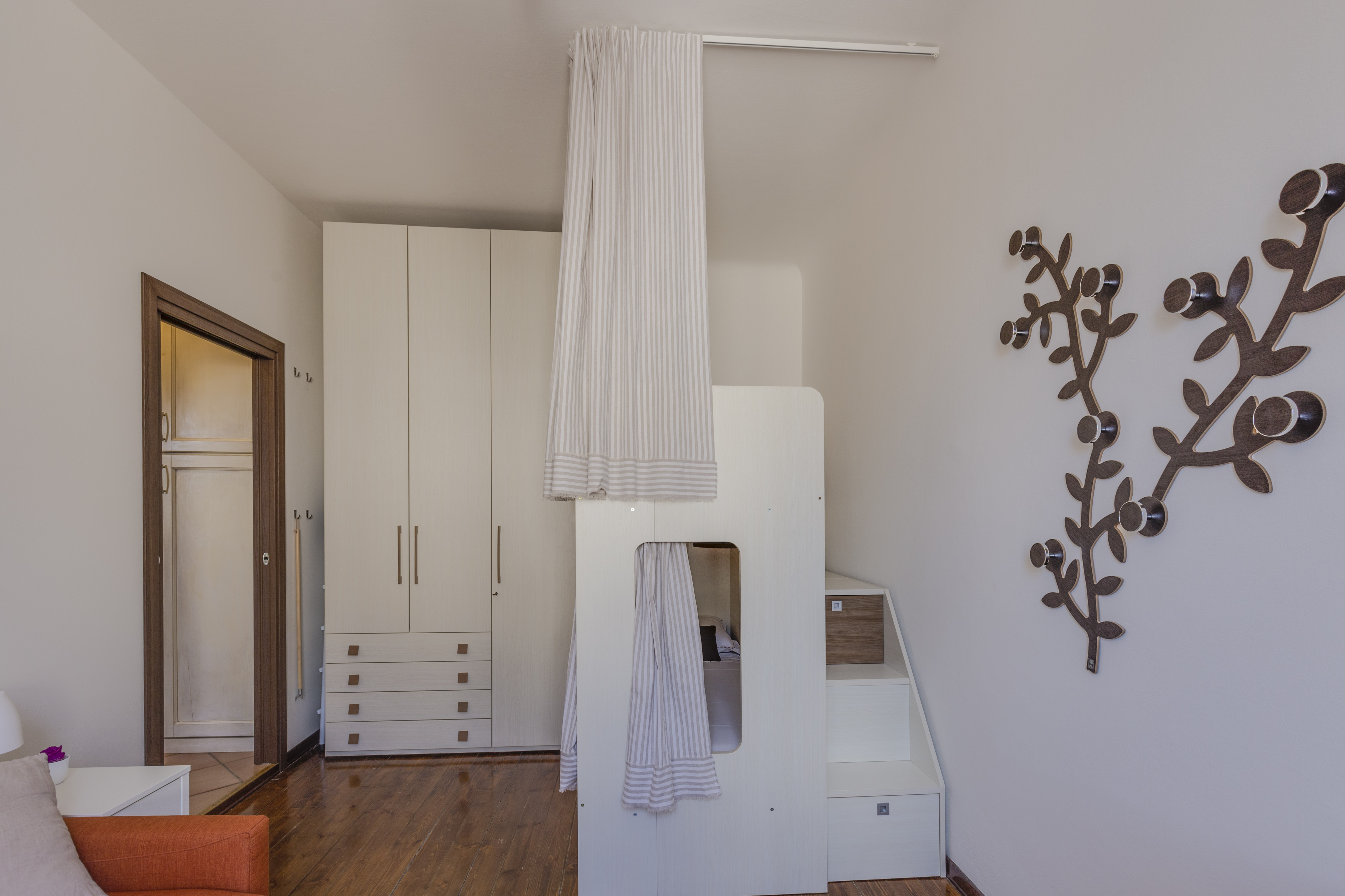 Bedroom-with-wardrobe-and-modern-bunk-bed-NewInteriorSolutions.com