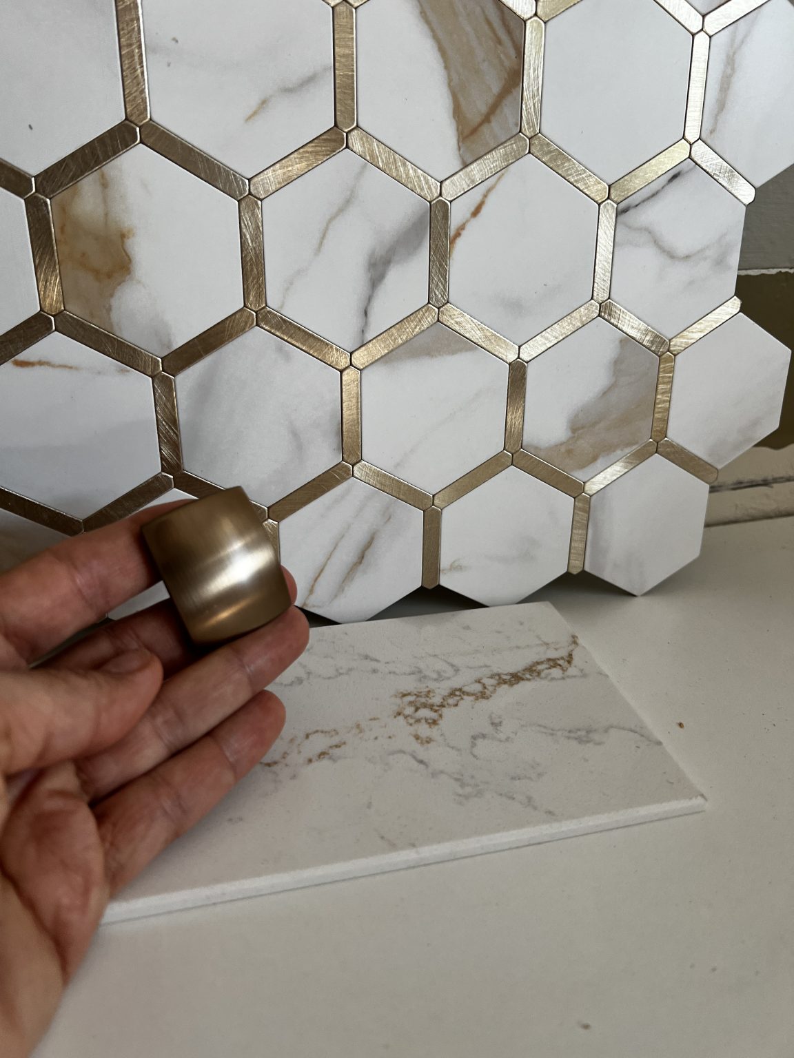 Hexagon backsplash tiles and quartz countertop